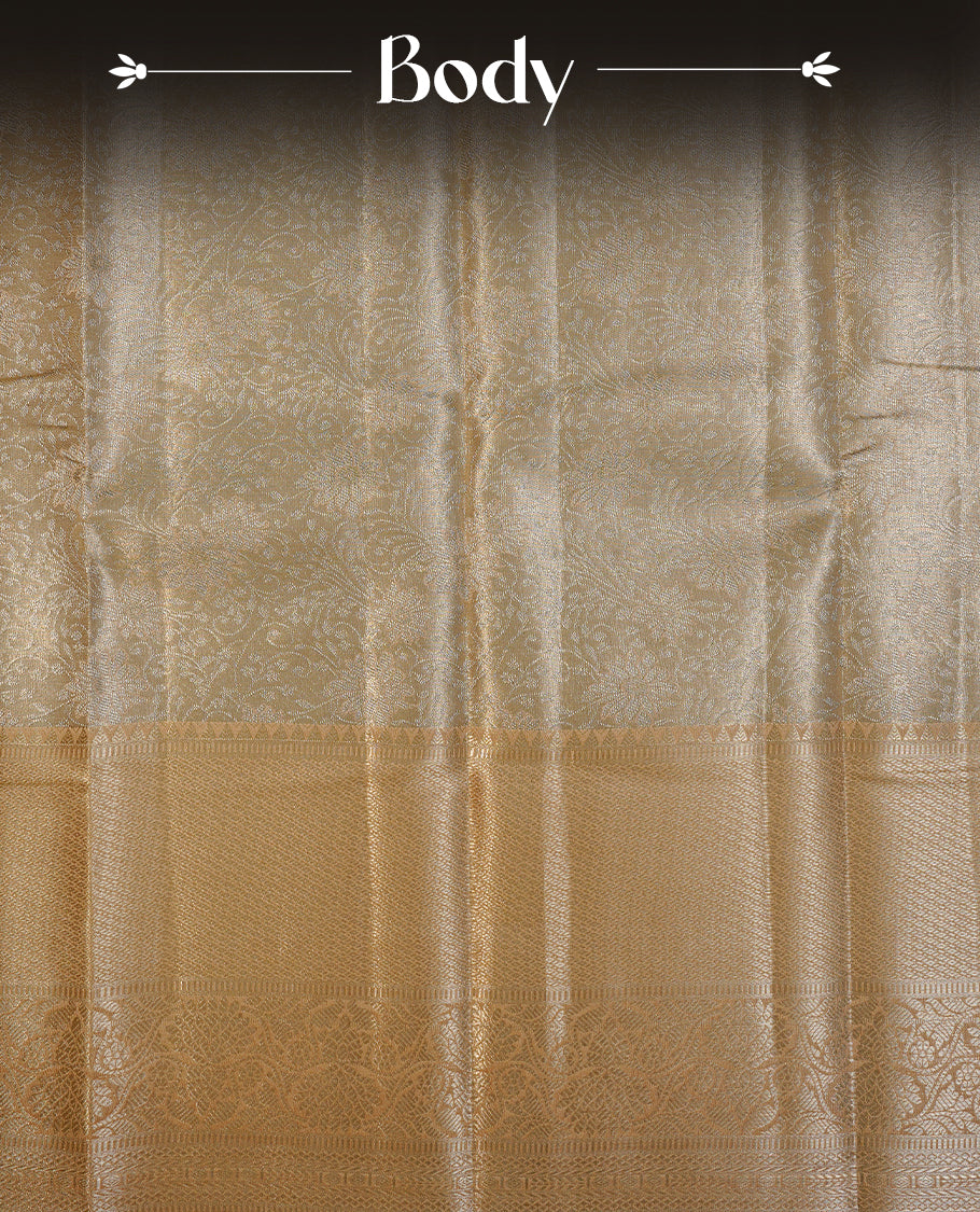 Light Gold colour semi tissue silk saree featuring silver zari pattern on body, contrast gold colour with gold zari traditional border, paired with matching blouse piece.