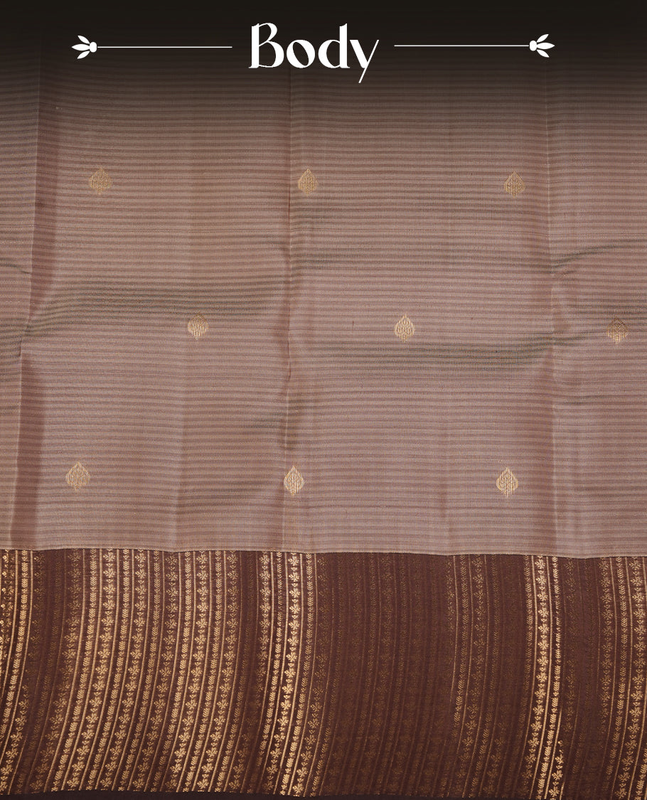 Cream grey colour soft silk saree featuring gold zari motifs on the body, complemented by a contrast chocolate traditional zari border and pallu, paired with matching blouse piece.