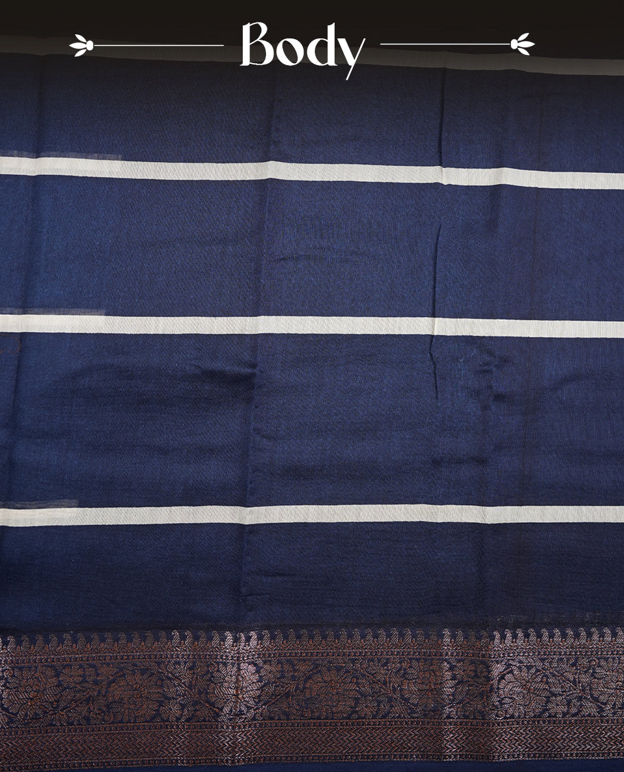 Dark blue colour chanderi silk saree featuring white stripped print pattern across body, with Antique zari pattern border and paired with matching blouse.