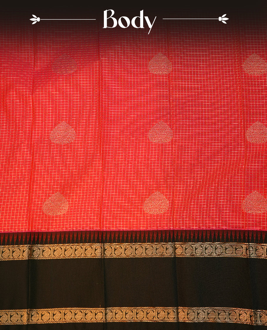 Red coloured soft silk saree featuring gold zari stripes and motifs across the body, enhanced with a contrast Dark greenborder and pallu, paired with a matching contrast blouse piece.