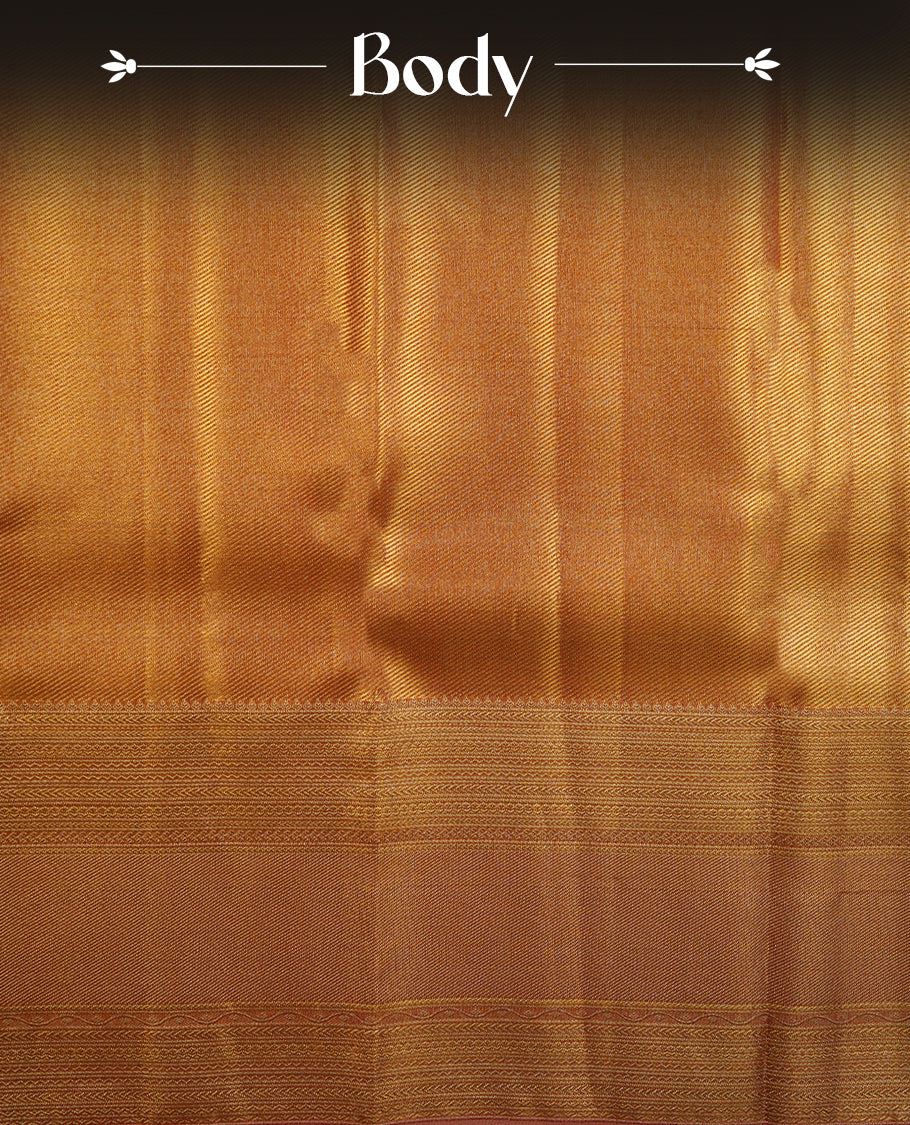 Gold colour kancheepuram tissue silk saree highlighting gold stripped zari pattern body, with contrast Pinkish beige colour colour with traditional border and paired with matching blouse.