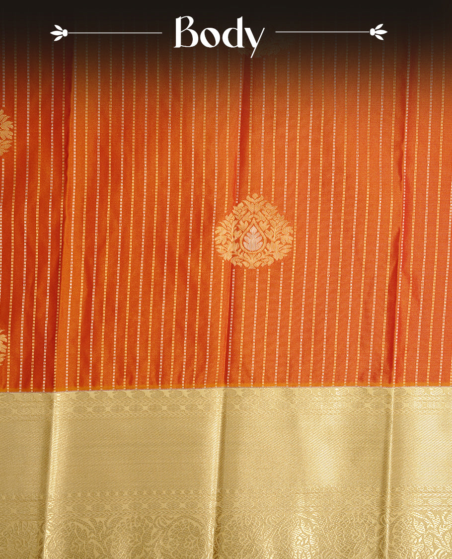 Orange coloured soft silk saree featuring gold zari stripes and motifs across the body, enhanced with a contrast Cream border and pallu, paired with a matching contrast blouse piece.