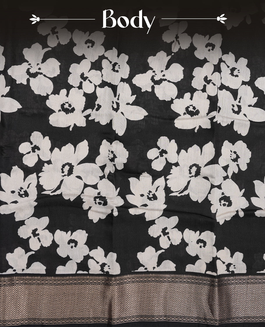 Black colour Viscos semi printed saree featuring a light golden zari border, abstract off white printed motifs on the body, and comes with a matching blouse