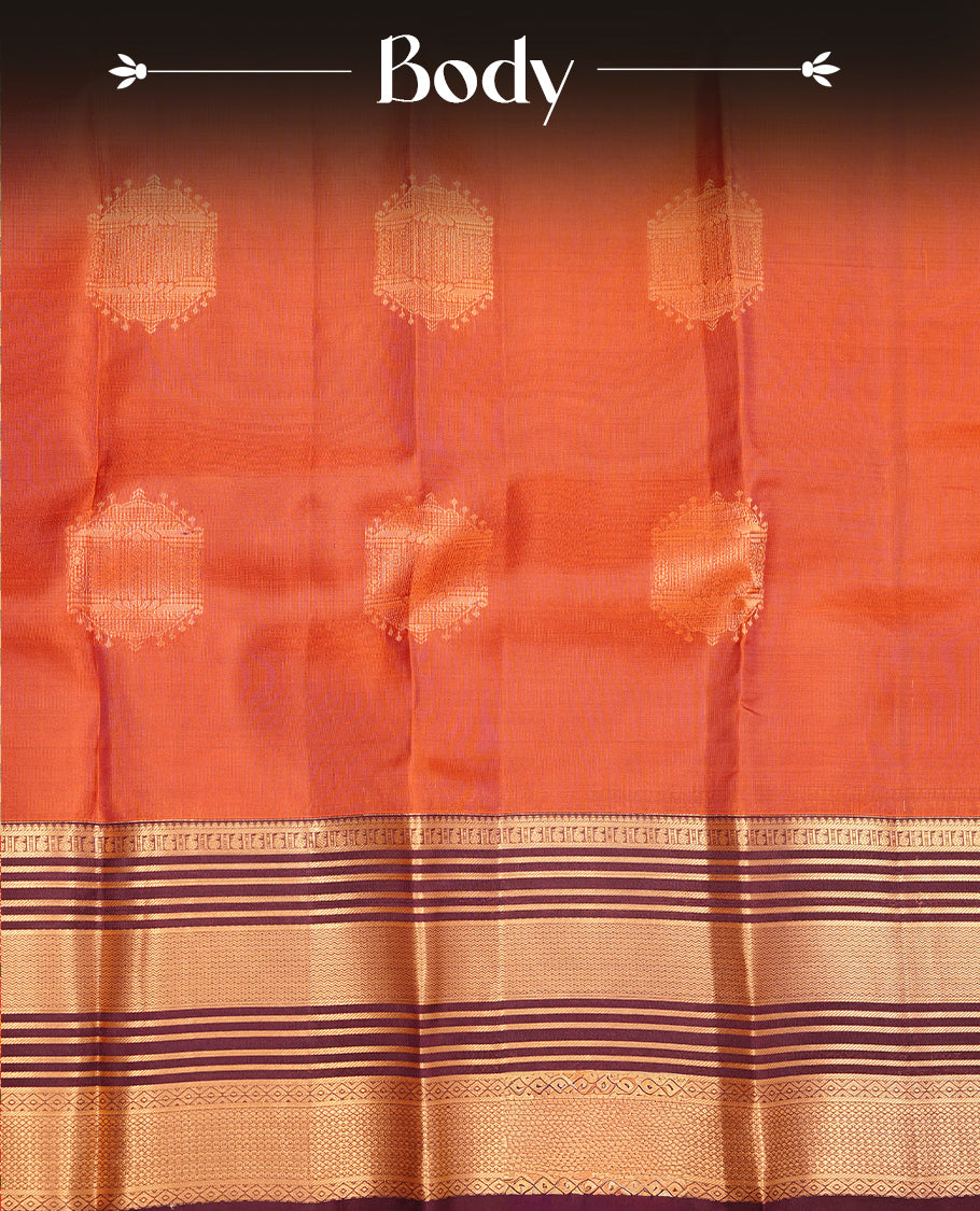 Burnt orange colour traditional kancheepuram silk saree featuring gold zari motifson body, complemented by contrast burgundy colour with gold zari traditional border, paired with matching blouse piece.