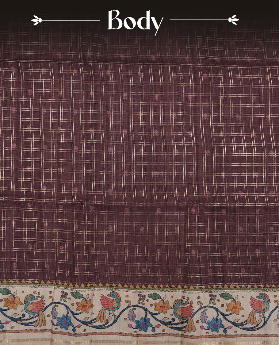 Maroon colour semi tusser silk saree featuring gold zari check pattern with floral butti motifs, with contrast floral kodi & bird pattern and paired with matching blouse.