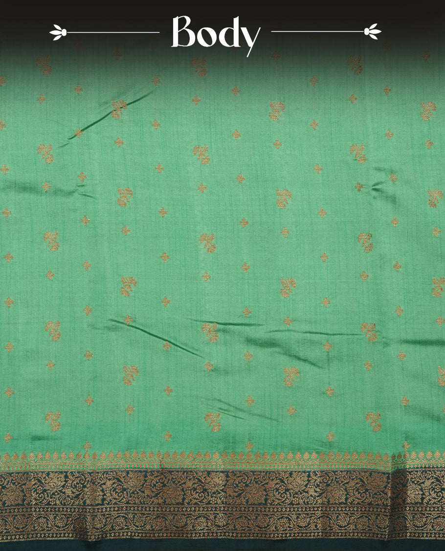 Teal colour Pure banaras soft silk saree featuring Antique zari motifs on body, contrast dark teal colour border , traditional pallu and paired with matching blouse