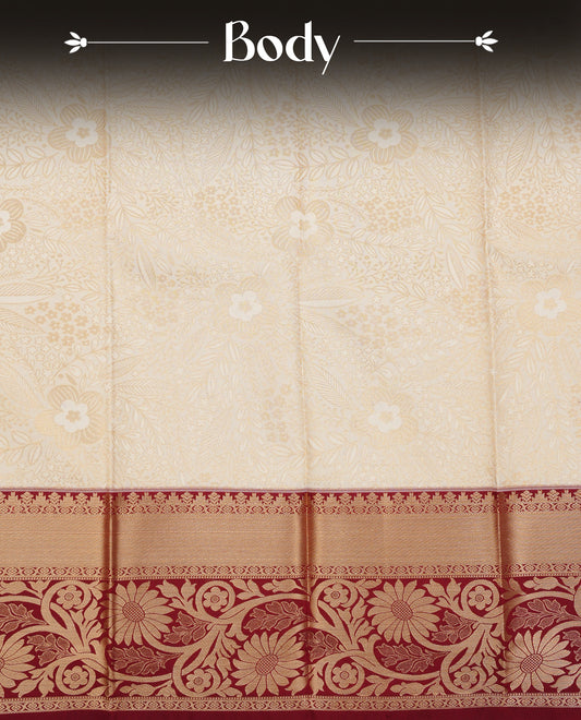 Off white colour silk saree featuring gold zari floral patterns on body, contrast maroon with gold zari traditional border, contrast grand pallu comes with matching blouse piece .