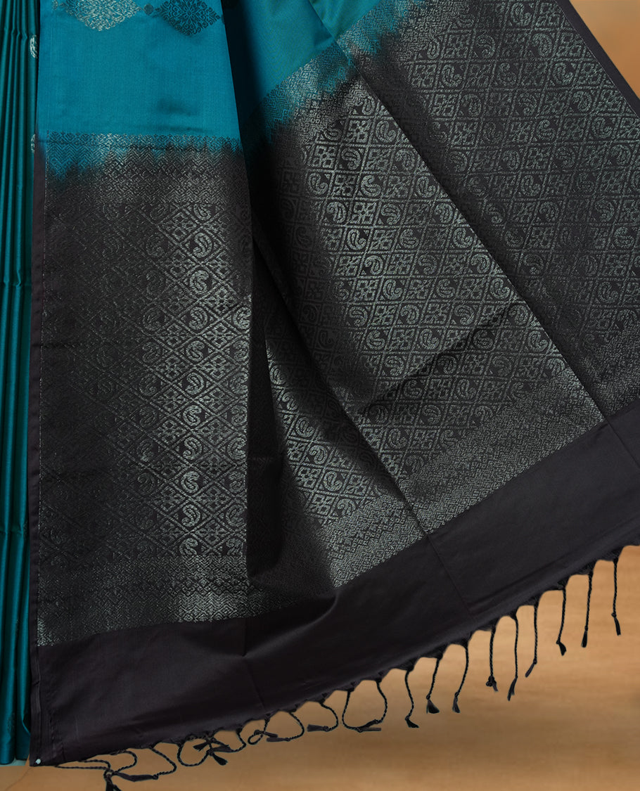 Aqua green colour soft silk saree featuring Antique zari motifs on body with Highlighting contrast Dark purple colour pallu and paired with matching blouse piece.