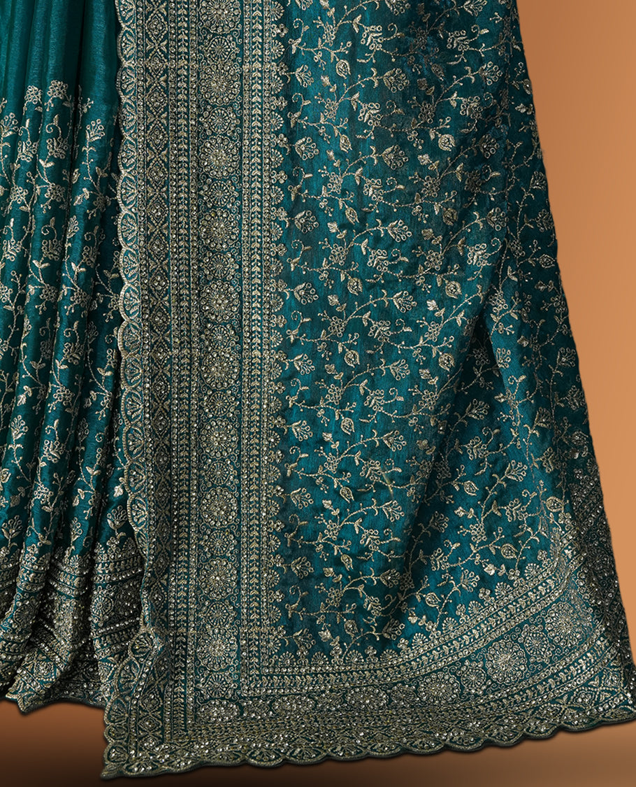 Sky blue colour velvet chiffon designer saree in elegant two tone shades, featuring light gold zari, kodi work with handwoven style thread aari & dori embroidery work, Swarovski stone work and all over motifs, comes with matching blouse.