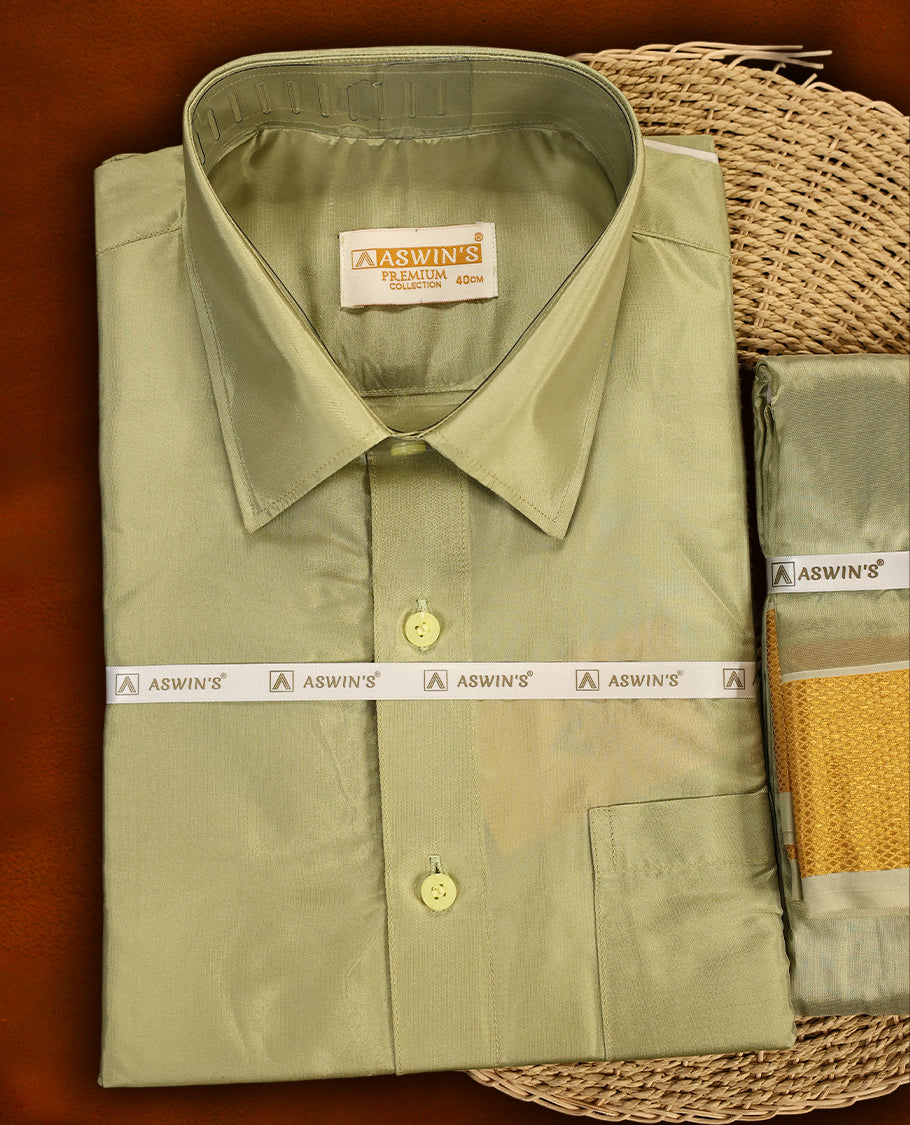 Fir green colour Aswin’s wedding set featuring a premium silk shirt, matching dhoti with rich golden zari border, complemented by a towel and fragrance, crafted for graceful festive celebrations.