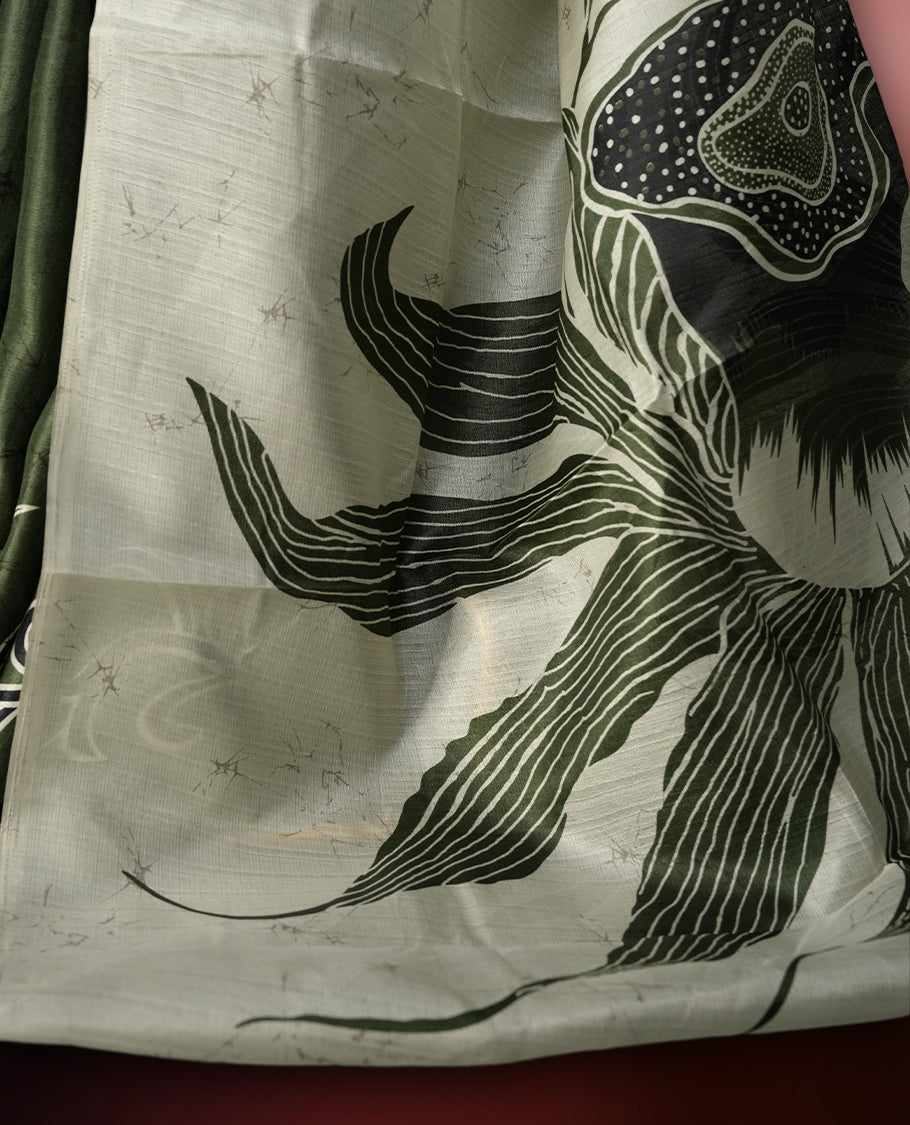 Olive green colour saree with striking off white floral patterns, merging modern minimalism with timeless charm & paired with a matching blouse.