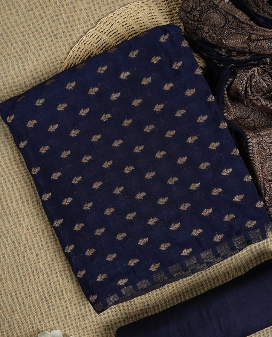 Navy blue suit material adorned with intricate light copper toned zari motifs weaving, exuding timeless elegance & Paired with a beautifully woven dupatta featuring floral and motifs and a matching plain bottom.