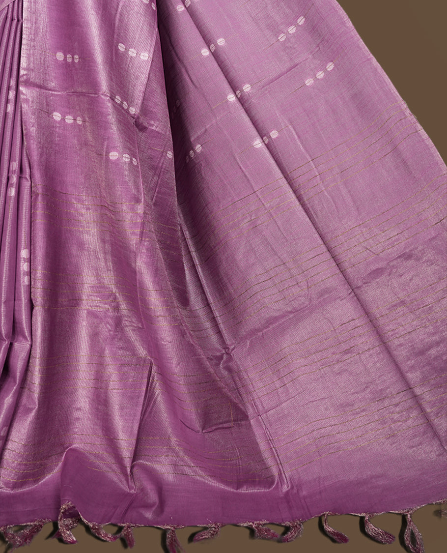 Lavender colour semi jute saree adorned with delicate woven motifs and a subtle sheen, The tassel detailed pallu enhances its charm & Paired with a matching blouse piece for an elegant finish.