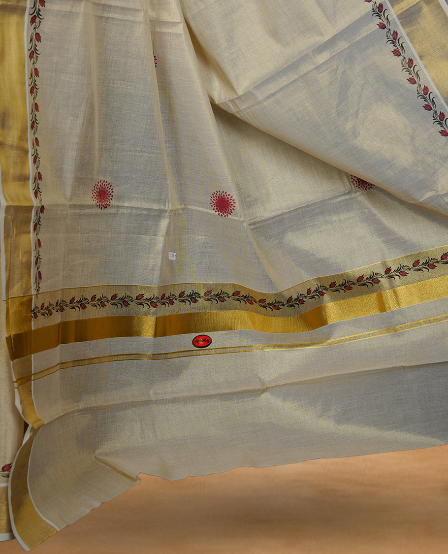 Off white colour Tissue Kerala saree featuring delicate floral border detailing, complemented by a classic golden zari border and traditional pallu, paired with a matching blouse.
