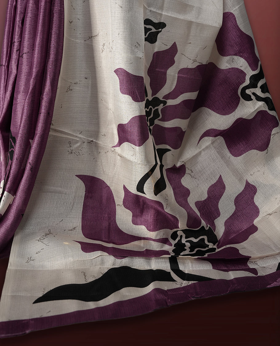Onion pink and off white saree featuring striking black floral prints across the body, offering a chic and elegant appeal & Soft, lightweight fabric ensures graceful drapes, paired with a matching blouse.