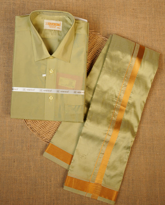 Firgreen colour shirt and dhoti with gold colour border, paired with matching colour silk saree featuring gold zari buttas and traditional border paired with matching blouse piece.