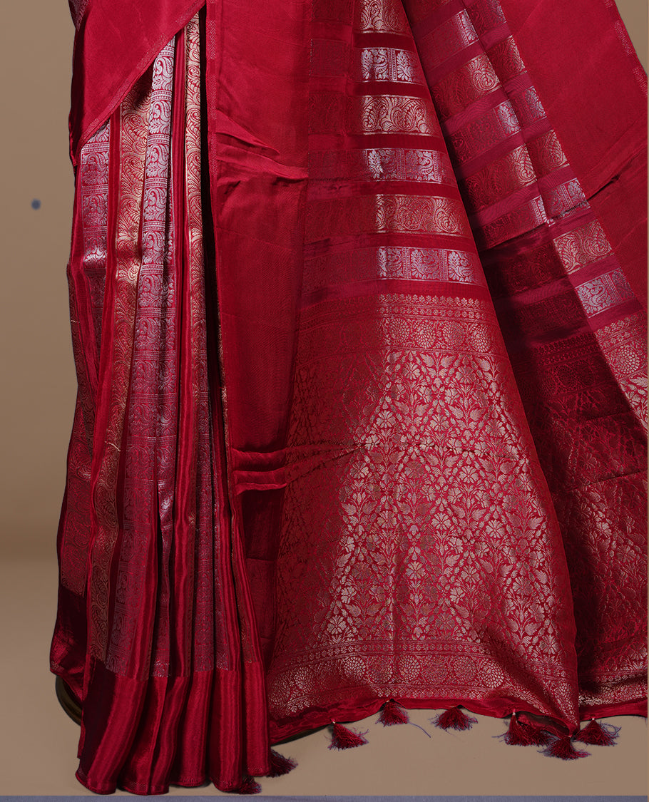 Rani pink colour banaras crepe saree featuring gold & silver zari design stripes on body, complemented by self colour border, paired with matching blouse piece.