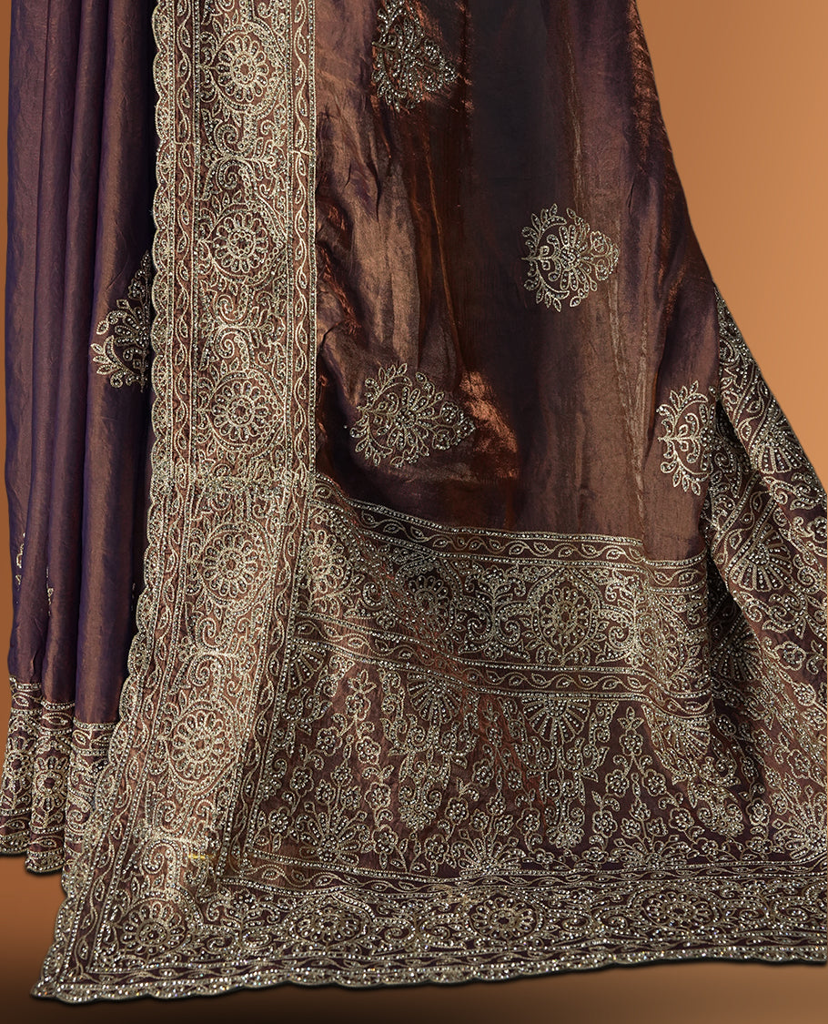 Double shaded Brown colour velvet chiffon designer saree in elegant two tone shades, featuring light gold zari, kodi work with handwoven style thread aari & dori embroidery work, Swarovski stone work and all over motifs, comes with matching blouse.