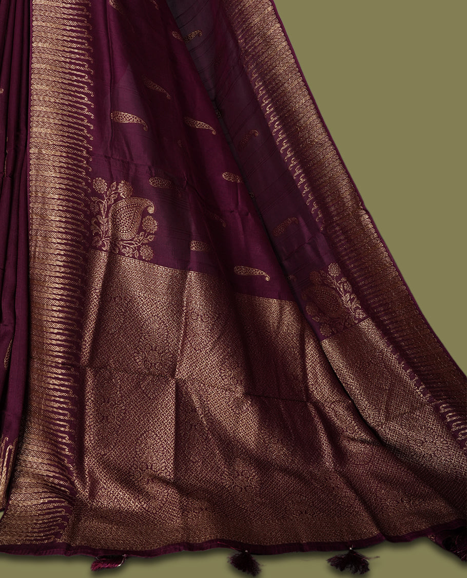 Grape colour semi Banarasi Tussar Georgette saree with delicate gold zari buttas on the body, a rich golden zari pallu, and detailed woven border & Comes with a matching blouse piece.