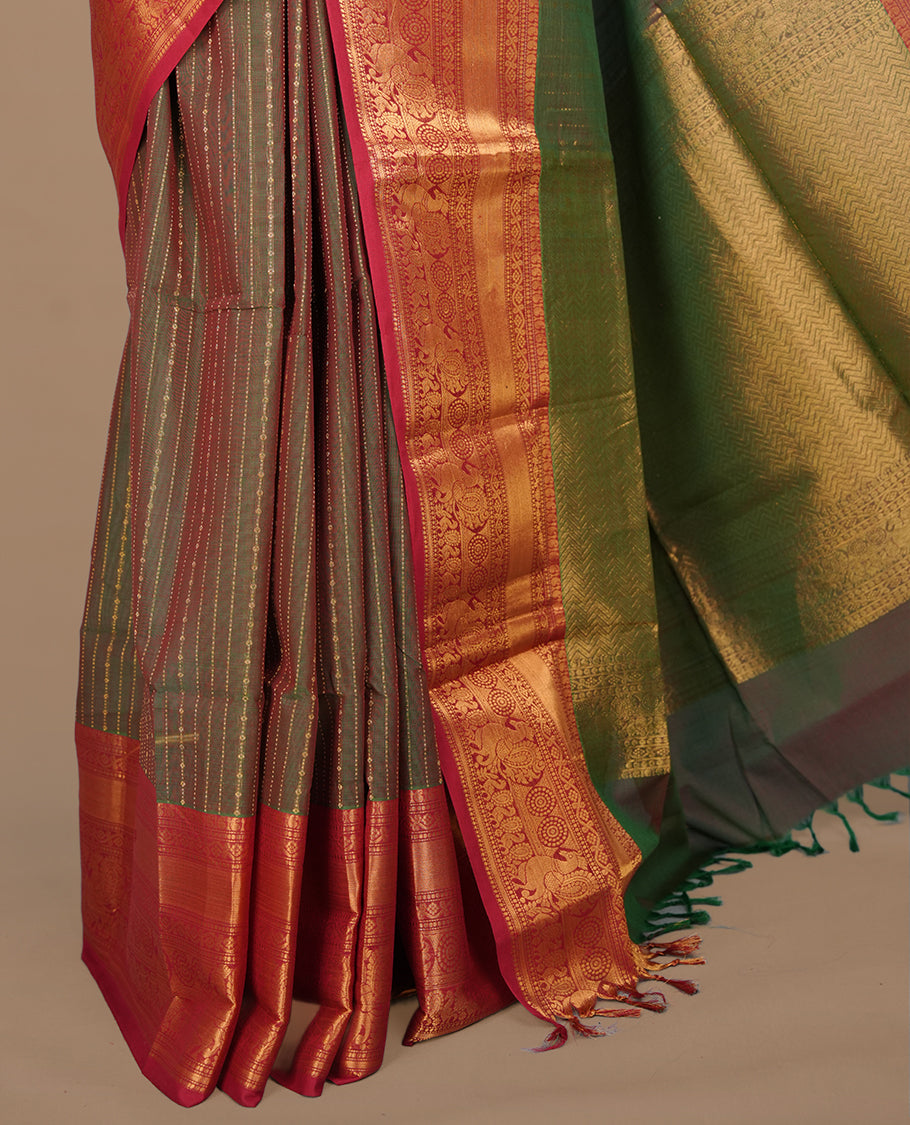 Green & red double shade colour chettinad saree featuring gold zari stripes on body, complemented by contrast Red colour with traditional border, paired with matching blouse piece.