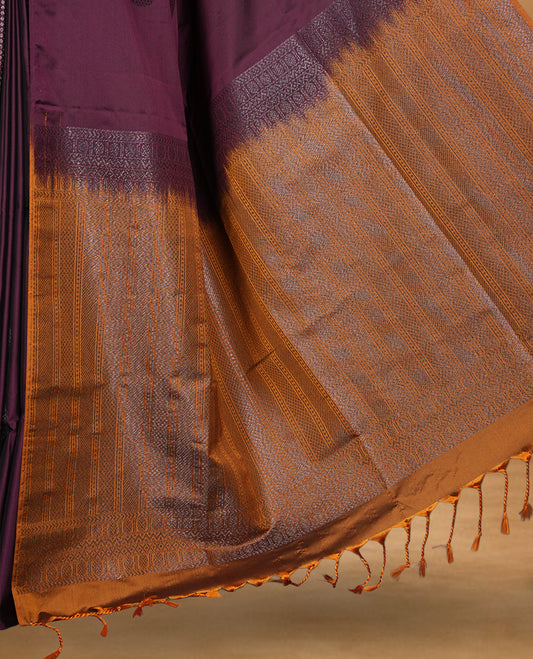 Deep plum colour soft silk saree featuring Antique zari motifs on body with Highlighting contrast Mustard colour pallu and paired with matching blouse piece.