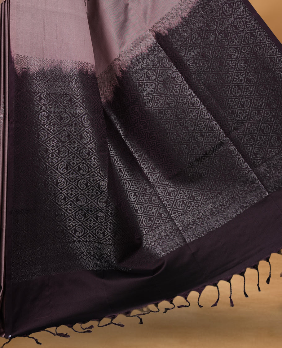 Old rose colour soft silk saree featuring Antique zari motifs on body with Highlighting contrast wine colour pallu and paired with matching blouse piece.