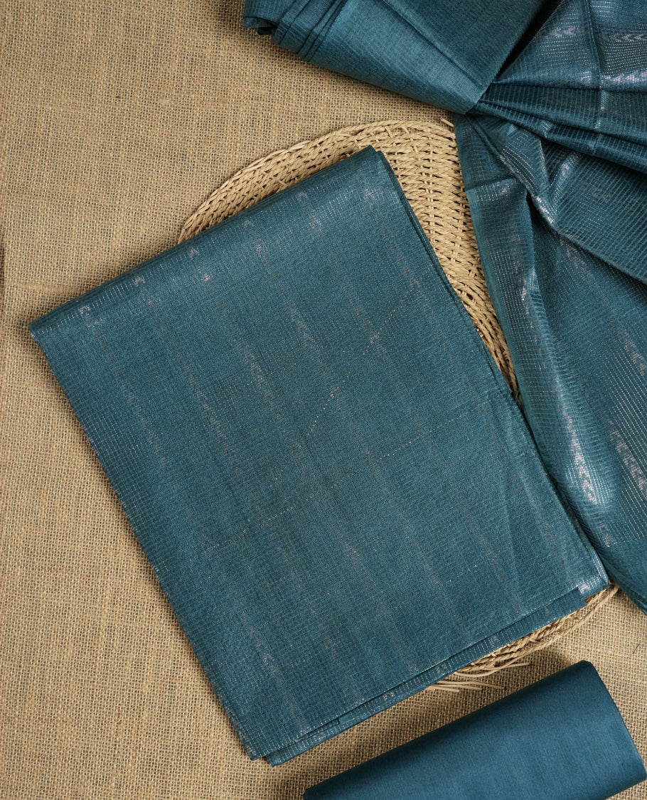 Steel blue colour Tussar suit material adorned with intricate woven patterns and subtle motifs, exuding ethnic elegance & Paired with a beautifully bordered dupatta and a matching plain bottom.