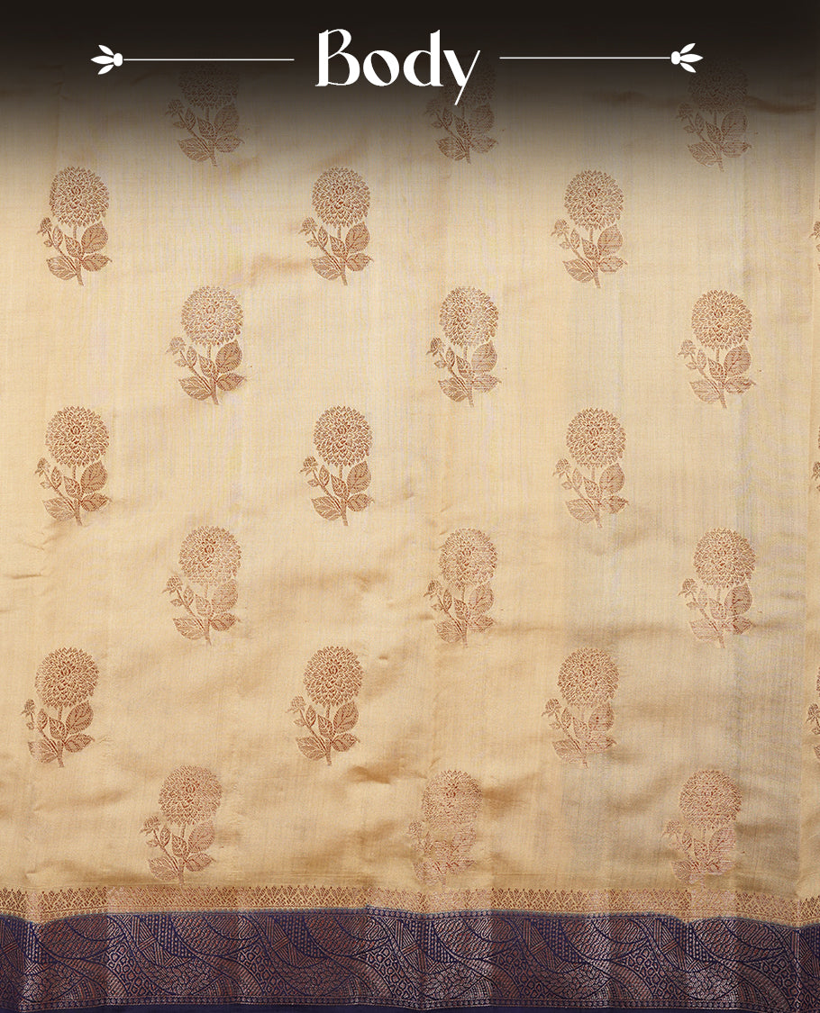 Cream beige Banaras soft silk saree with gold Floral motifs on body, with contrast Blue colour floral pattern on pallu, border, and Matching blouse.