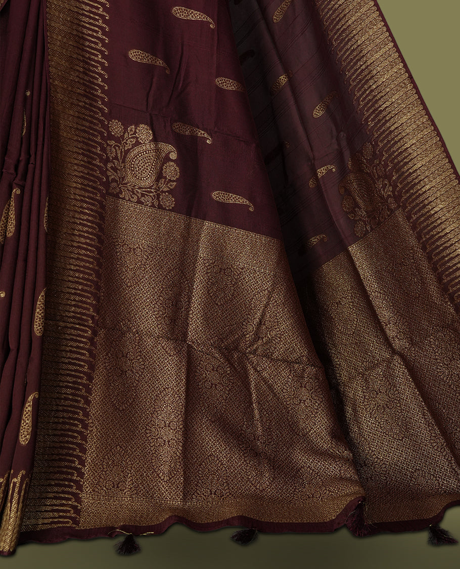 Dark coffee brown colour semi Banarasi Tussar Georgette saree with delicate gold zari buttas on the body, a rich golden zari pallu, and detailed woven border & Comes with a matching blouse piece.