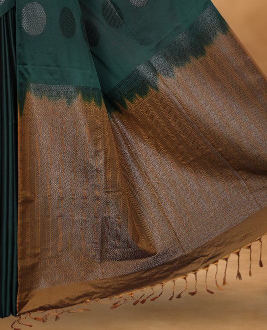 Green colour soft silk saree featuring Antique zari motifs on body with Highlighting contrast Mustard colour pallu and paired with matching blouse piece.