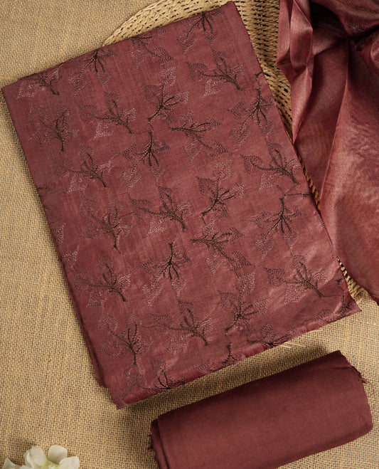 Chocolate brown colour tussar suit material adorned with intricate elegant embroidery work, exuding ethnic elegance & Paired with a beautifully embroidery dupatta and a matching plain bottom.