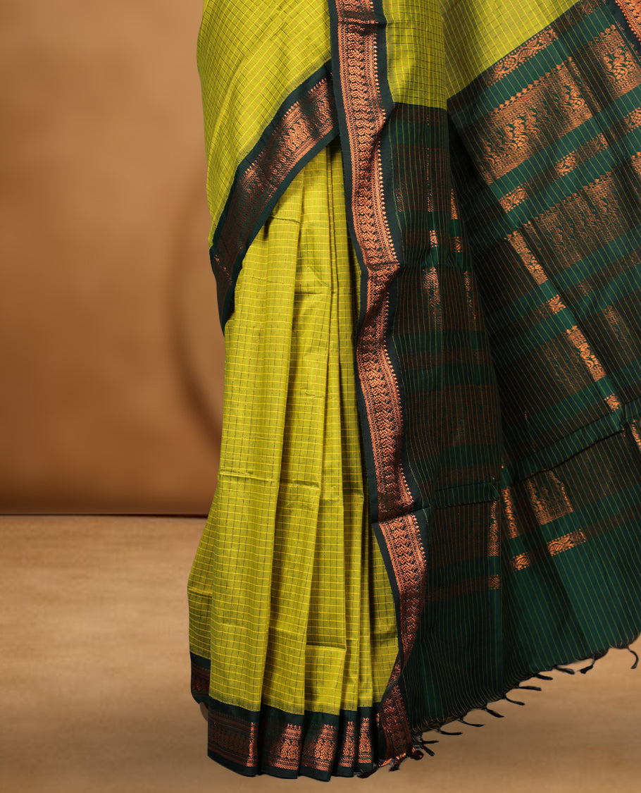 Lemon colour kalyani cotton saree featuring Antique zari check pattern on body, contrast Green colour border with antique zari pattern, paired with matching blouse piece.
