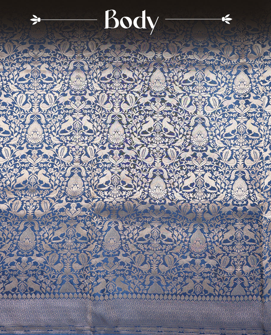 Dark Blue colour Mysore Crepe Silk saree fearturing gold zari kodi visiri & Animal brocade pattern on body and self colour border paired with matching blouse