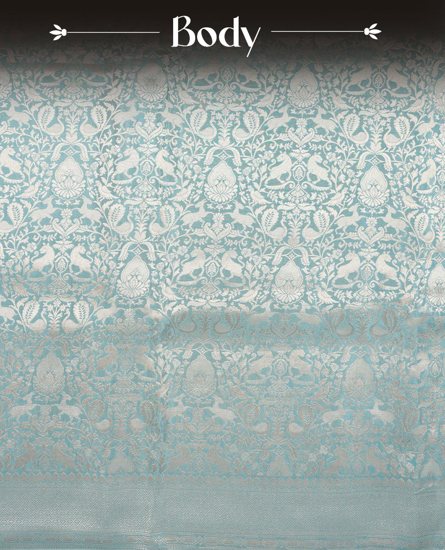 Light Blue colour Mysore Crepe Silk saree fearturing gold Zari kodi visiri & Animal brocade pattern on body and self colour border paired with matching blouse