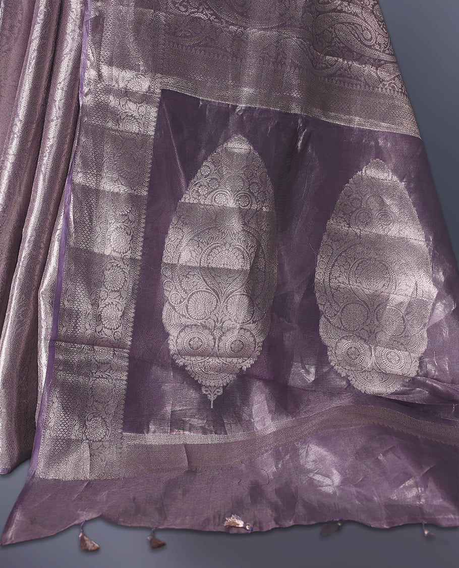 Lavender Pure tissue Banaras saree featuring intricate silver zari weaving all over with a rich pallu and bold paisley motifs, offering a luxurious drape perfect for weddings, festive occasions, and grand celebrations