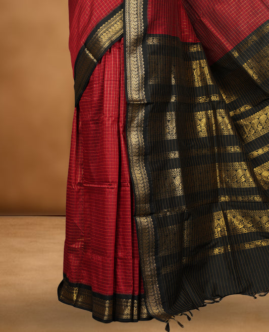 Maroon colour kalyani cotton saree featuring Antique zari check pattern on body, contrast Black colour border with antique zari pattern, paired with matching blouse piece.
