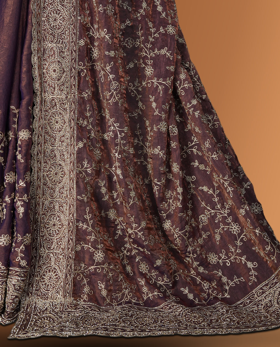 Purple & Brown colour velvet chiffon designer saree in elegant two tone shades, featuring light gold zari, kodi work with handwoven style thread aari & dori embroidery work, Swarovski stone work and all over motifs, comes with matching blouse.