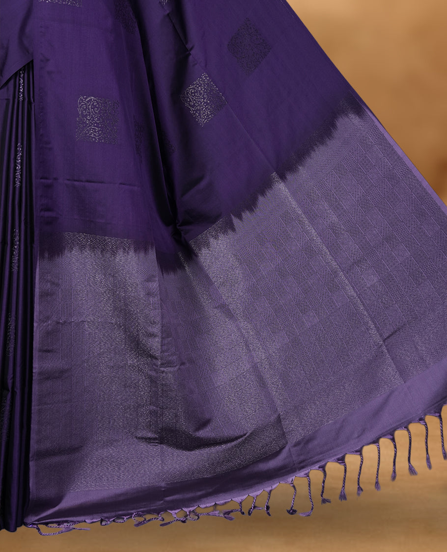 Dark purple colour soft silk saree featuring Antique zari motifs on body with Highlighting contrast Lavender colour pallu and paired with matching blouse piece.