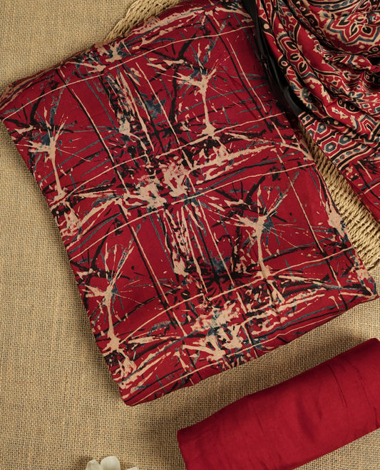 Deep maroon colour suit material featuring intricate hand block and batik inspired prints & Paired with a beautifully patterned dupatta and solid matching bottom.