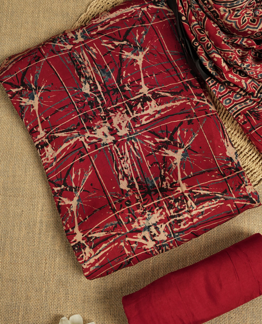 Deep maroon colour suit material featuring intricate hand block and batik inspired prints & Paired with a beautifully patterned dupatta and solid matching bottom.