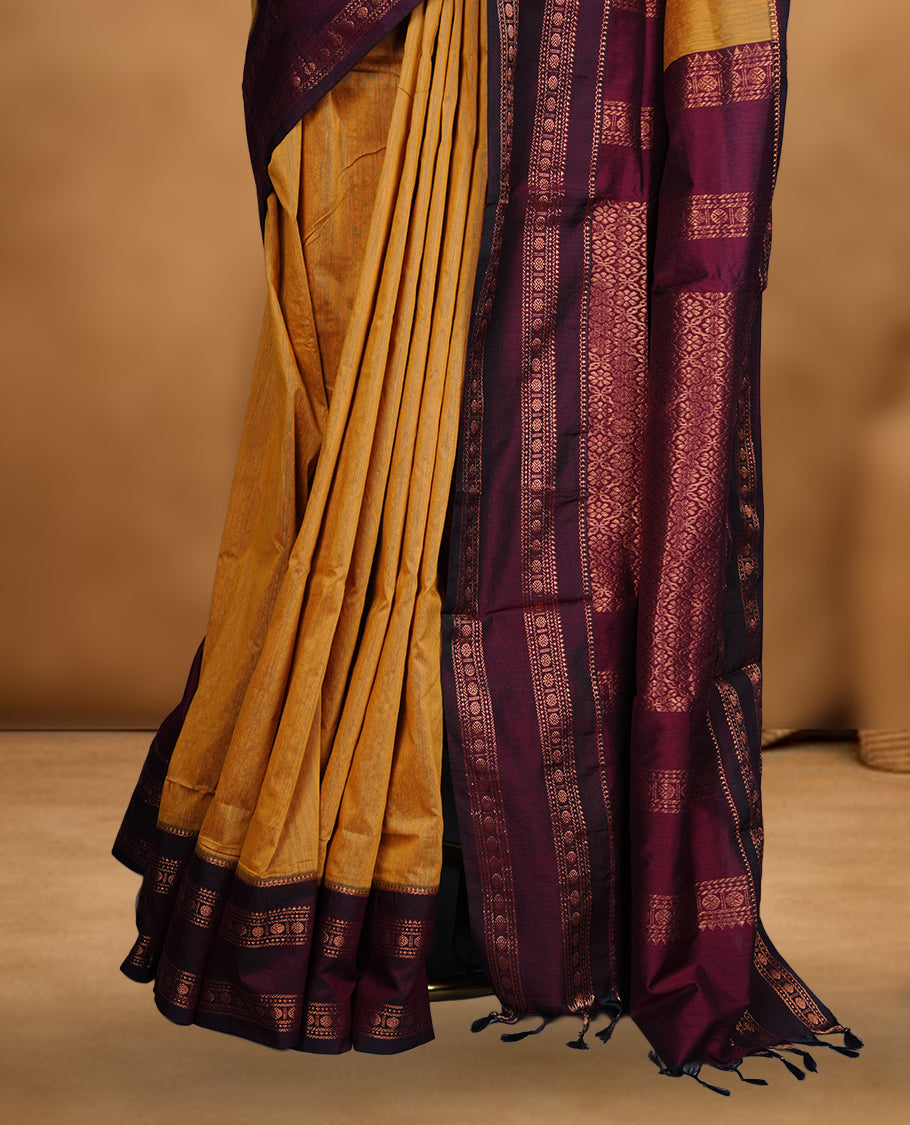 Mustard colour mixed Kalyani cotton saree with subtle zari motifs, maroon zari border and rich traditional pallu, paired with a matching blouse.