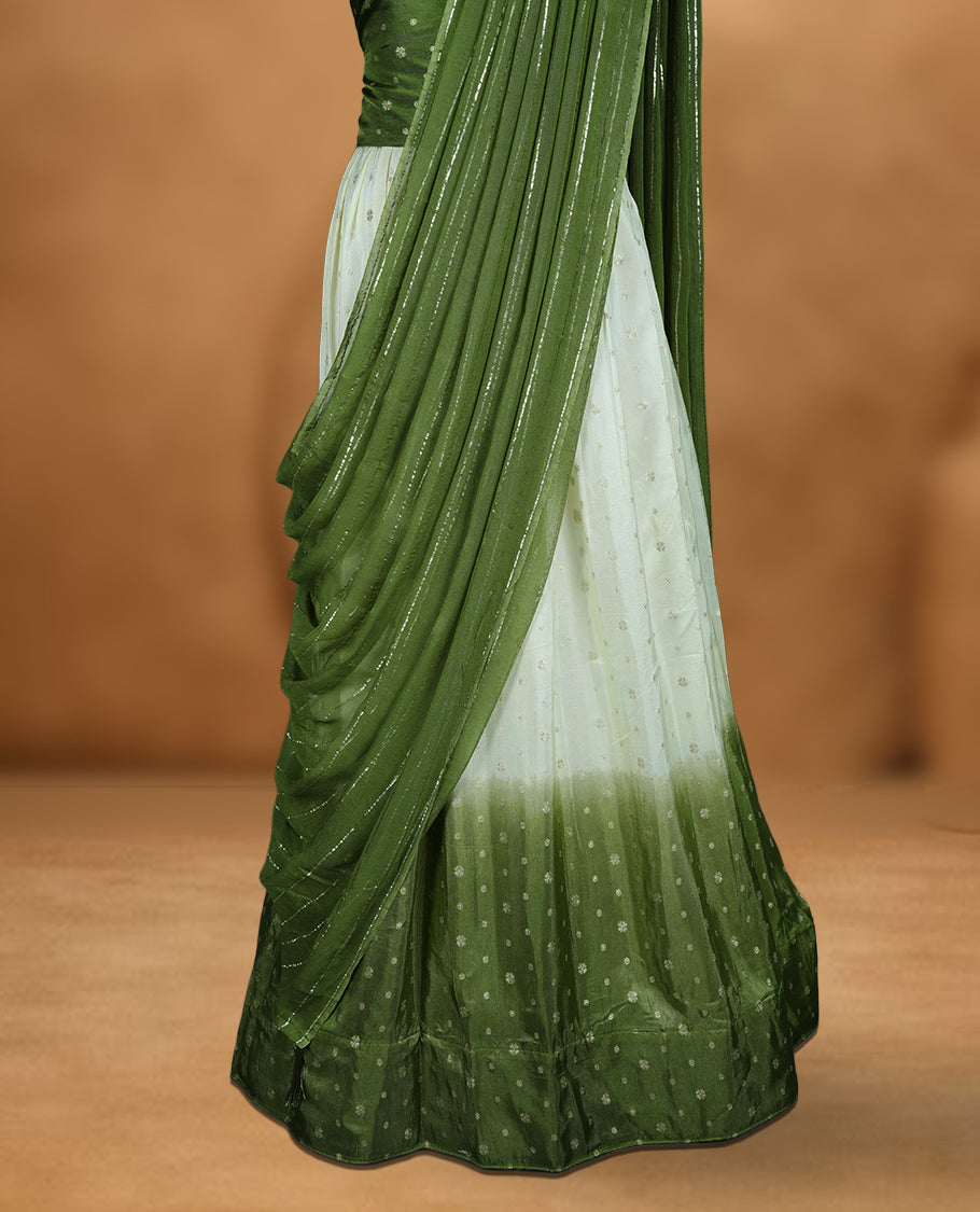 Off white semi banaras semi stitched dhavani set featuring gold zari motifs and contrast green colour border, unstitched gold zari blouse piece and matching Duptta with gold zari stripes.
