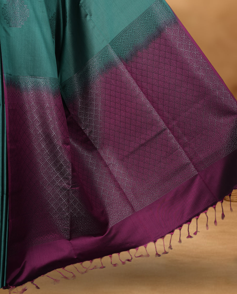 Cadmium green colour soft silk saree featuring Antique zari motifs on body with Highlighting contrast Pink colour pallu and paired with matching blouse piece.