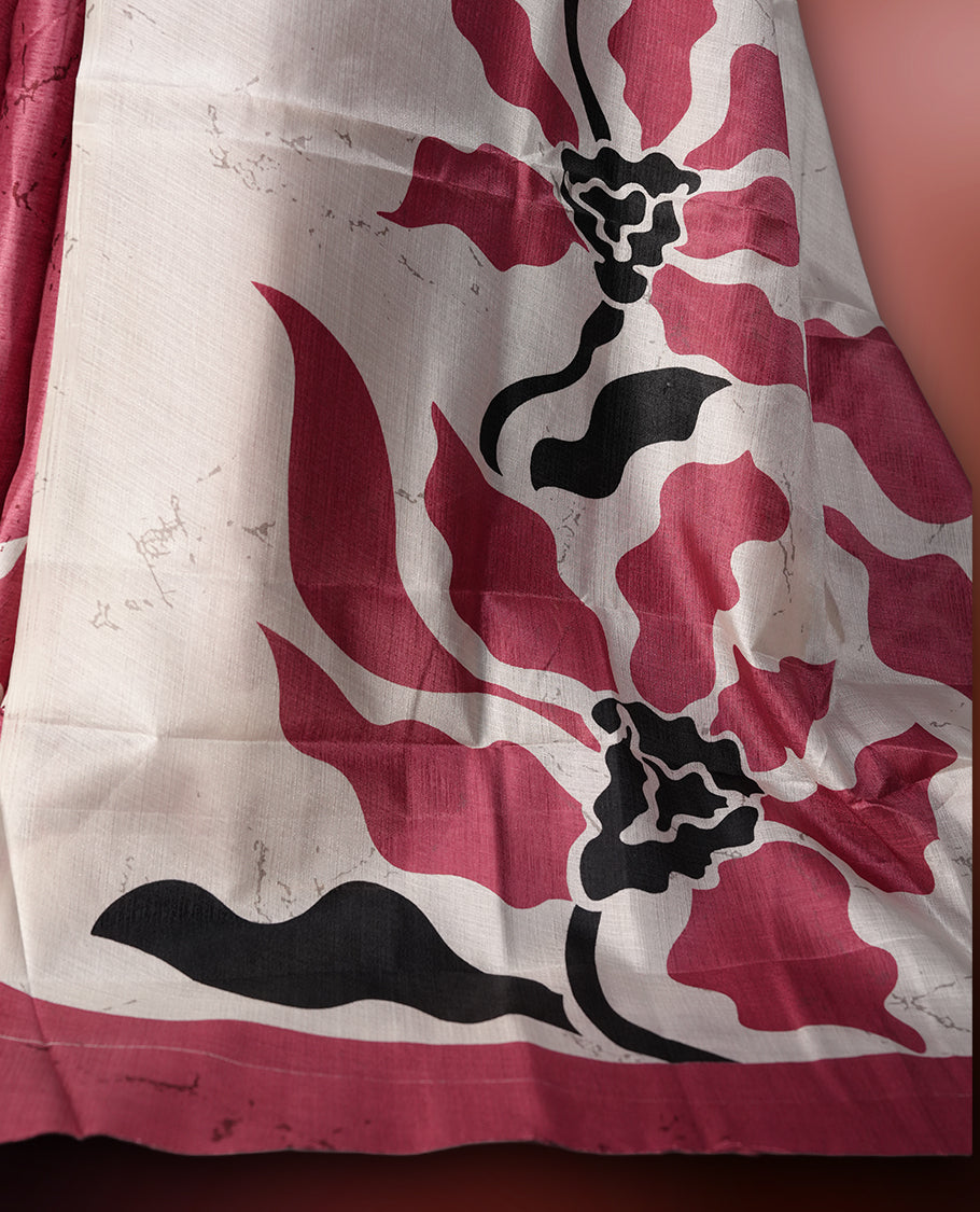 Dark onion pink colour saree with striking off white, black floral patterns, merging modern minimalism with timeless charm & paired with a matching blouse.