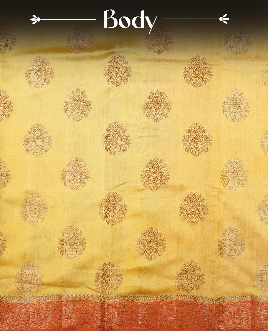 Gold Banaras soft silk saree with Antique zari motifs on body, with contrast Orange colour floral pattern on pallu, border, and Matching blouse.