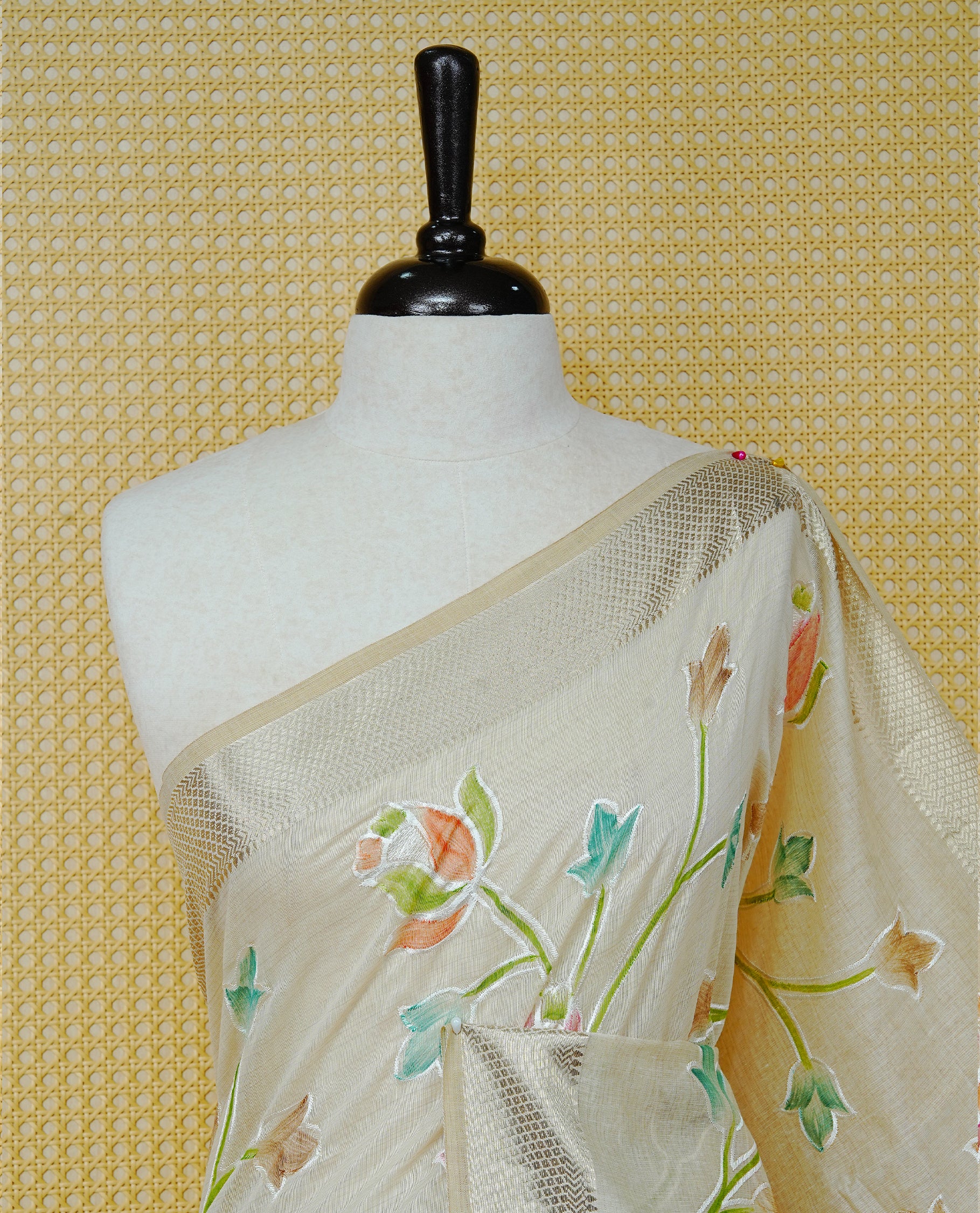 Cream Colour Tissue Kerala Saree Featuring Floral Kodi Threadwork Across The Body, Enhanced With A Light Gold Zari Border And A Light Green Floral Pallu, Finished With Gold Tassels And A Matching Blouse Piece