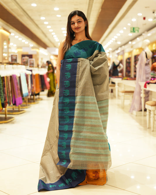 Navy Blue with Peacock green Bengal cotton saree featuring Ganga Jamuna Style Contrast Border with elephant motifs, Striped pallu.