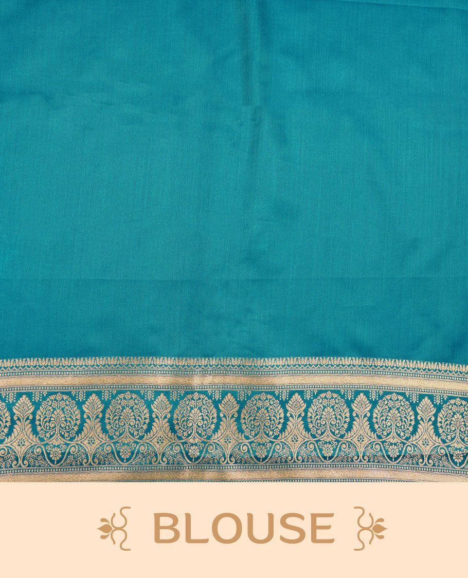 Teal blue colour Banaras Satin Crepe saree featuring gold zari floral motifs on the body, a richly woven traditional border with intricate gold zari detailing, and paired with a matching blouse.