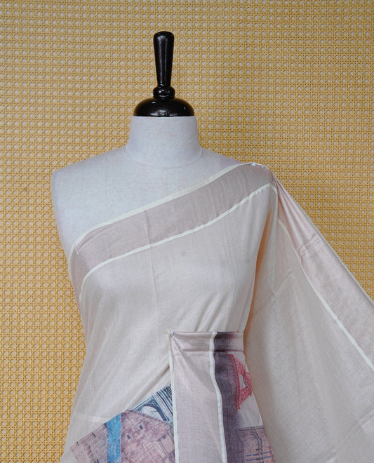 Cream colour Cotton Kerala Saree featuring a clean plain body with painted style digital prints of Seven Wonders, rose gold border, Finished with pink and black tassels, and paired with a matching blouse piece.