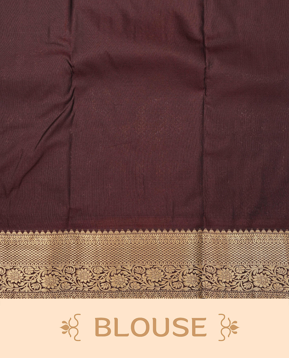 Cream colour semi wedding saree featuring gold zari check with motifs across the body, complemented by dark brown colour with traditional border. Comes with a matching blouse piece.